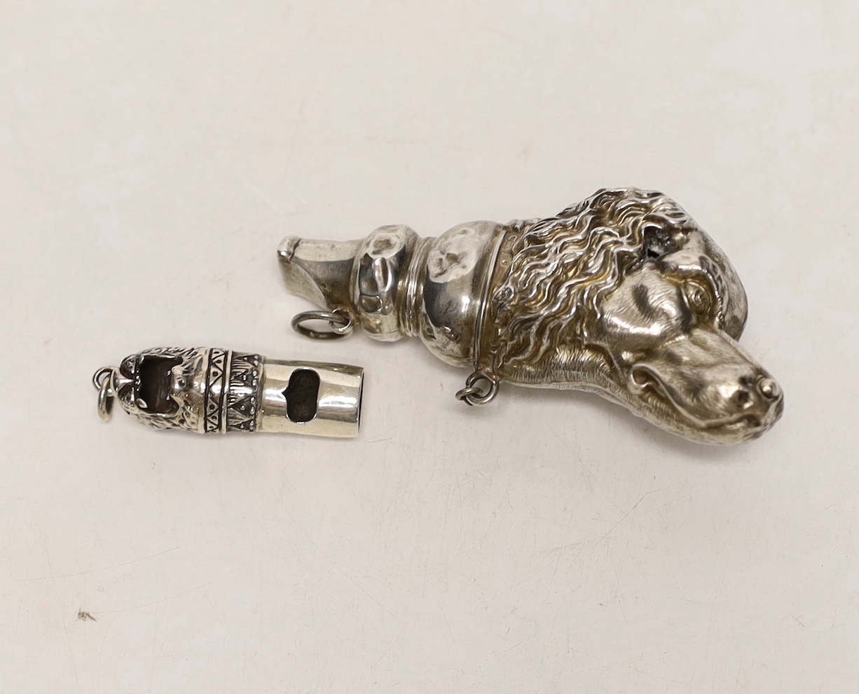 An Edwardian novelty silver whistle, modelled as a dog's head, Crisford & Norris, Birmingham, 1904, 76mm, together with a smaller modern 925 'leopard's head' whistle.